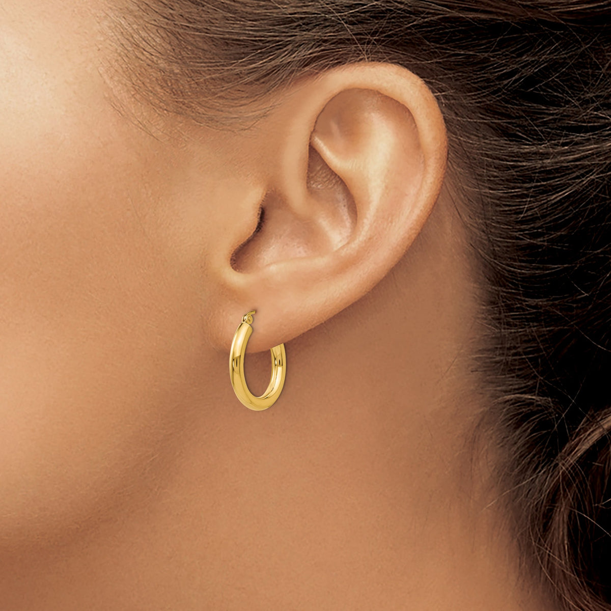 Thick Boi Hoops in 14kt yellow gold worn on model