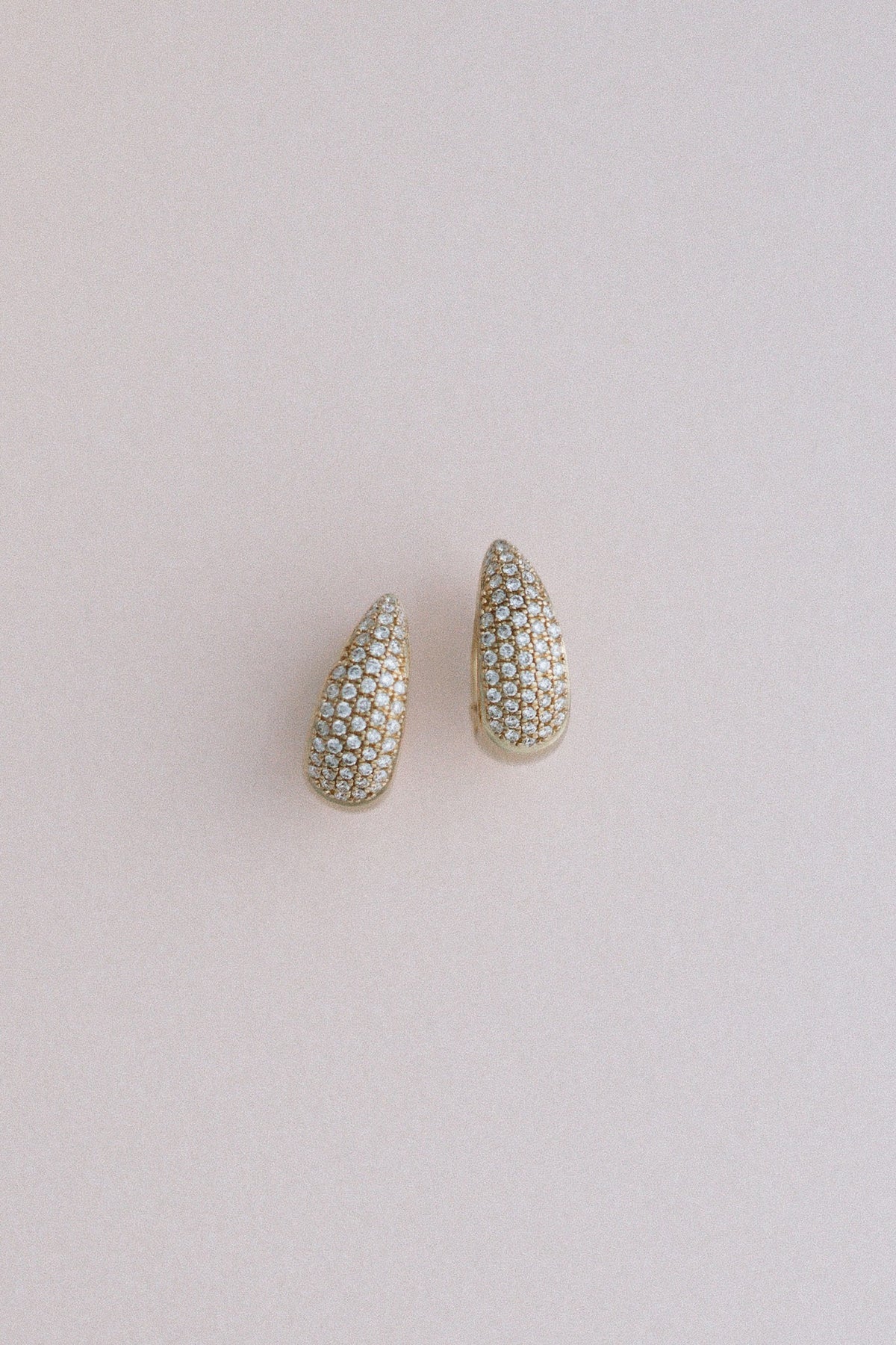 Demur Pavé Hoops, domed diamond pavé hoops in 14kt yellow gold on blush
