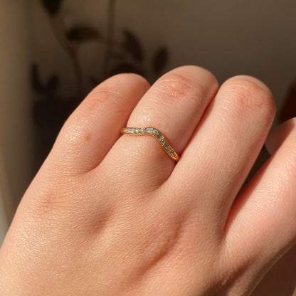 Jennie Kwon Diamond Staccato Wave Band with baguette and round diamonds in 14kt yellow gold, worn on the hand
