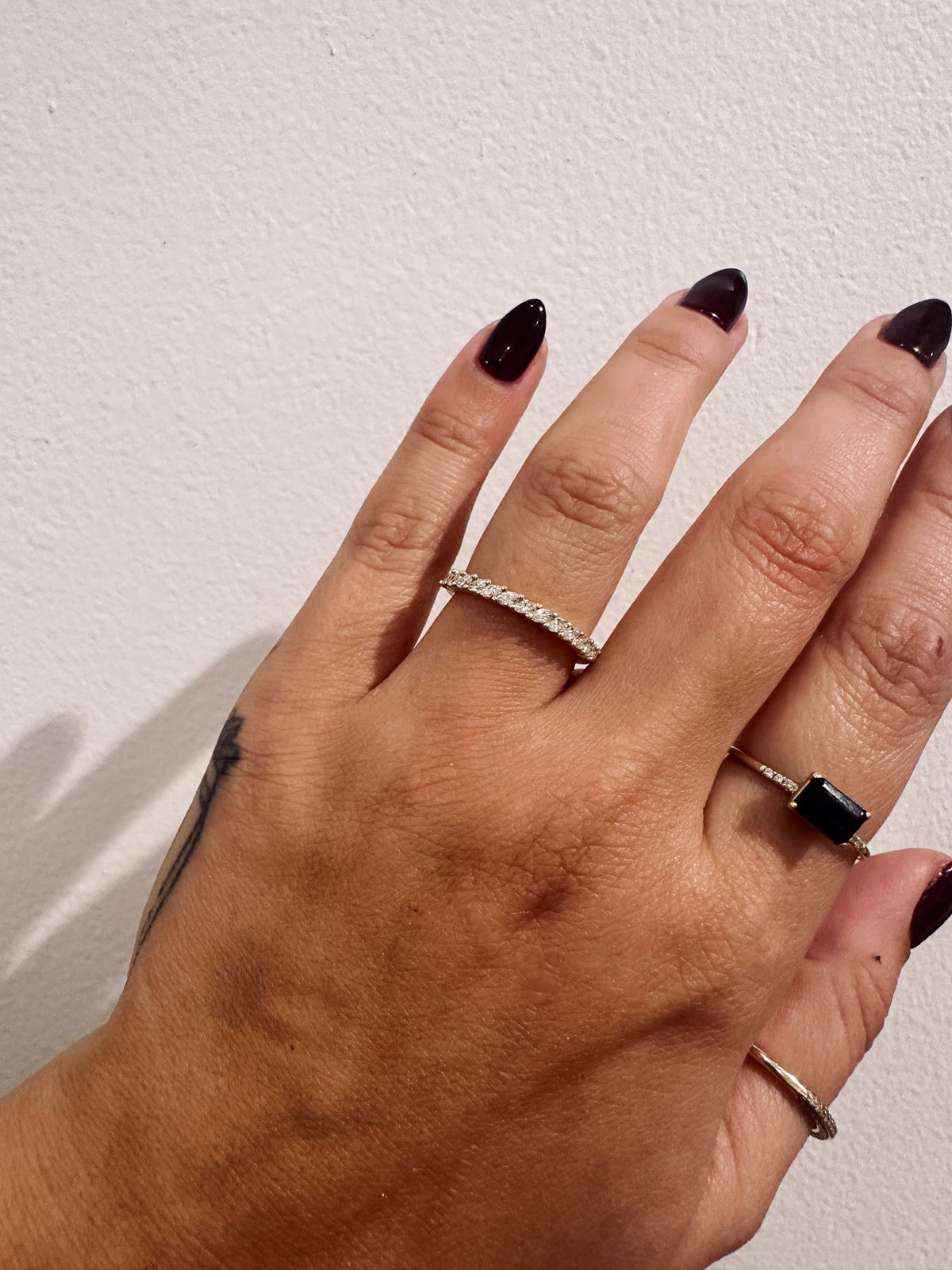 BB Marquise Eros wedding band in 14kt yellow gold with prong set marquise diamonds worn on the hand