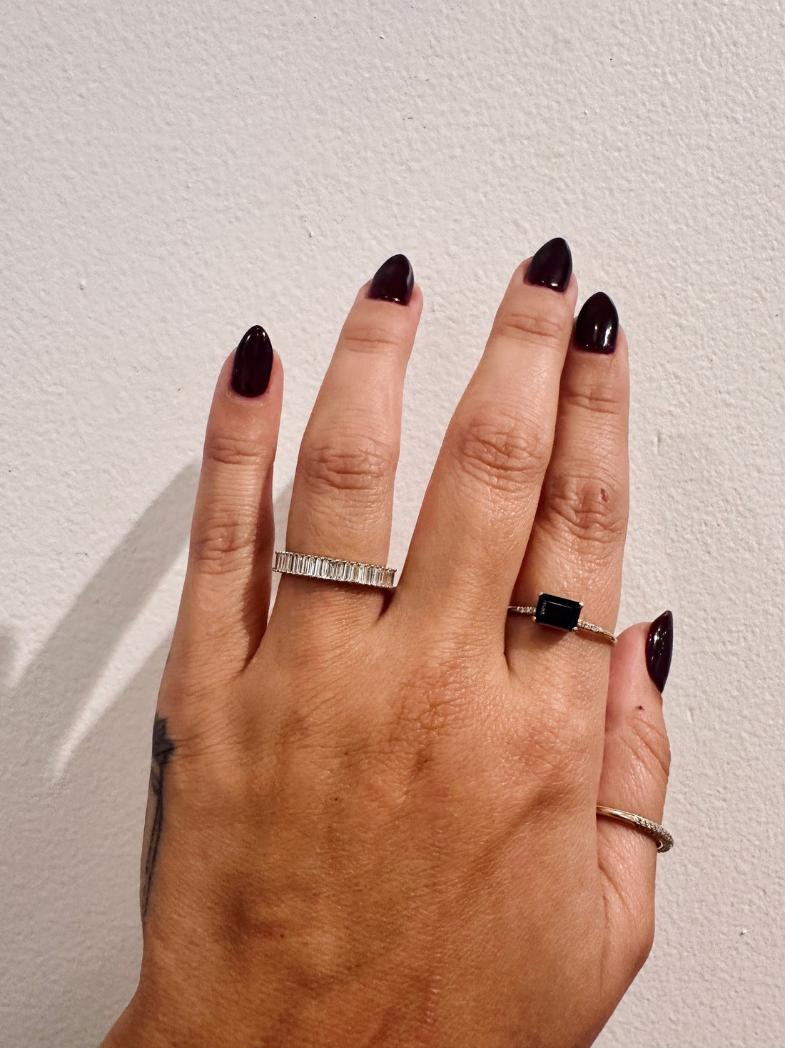 Baguette Incantations Wedding Band with vertical baguette diamonds worn on hand
