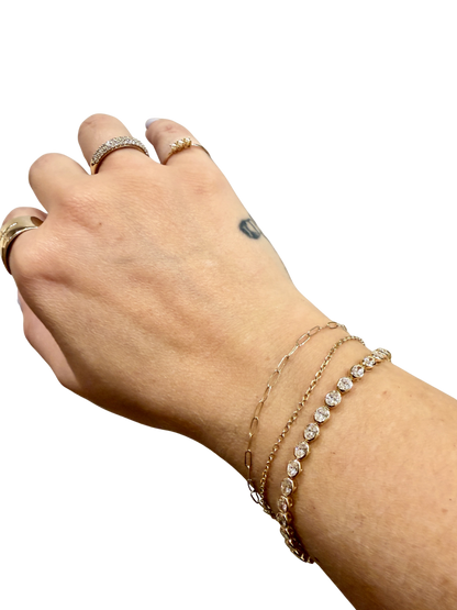 Oval Damsel Tennis Bracelet by Lane &amp; Kate, bezel set oval diamonds worn stacked on the wrist